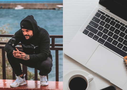 Mann mit Kamera in der Hand, daneben ein Laptop